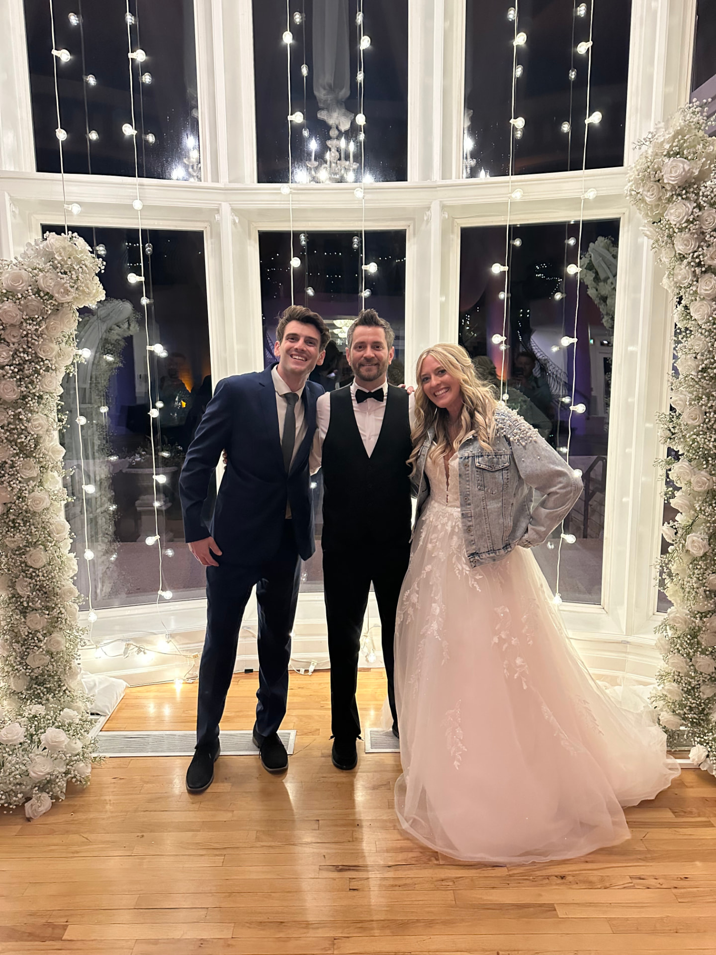 Matt La Rocca with a happy couple at a wedding